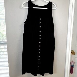 Black dress, above the knee, button down elastic waist size L.